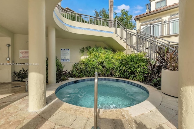 view of pool featuring a community hot tub