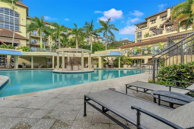 view of swimming pool with a patio