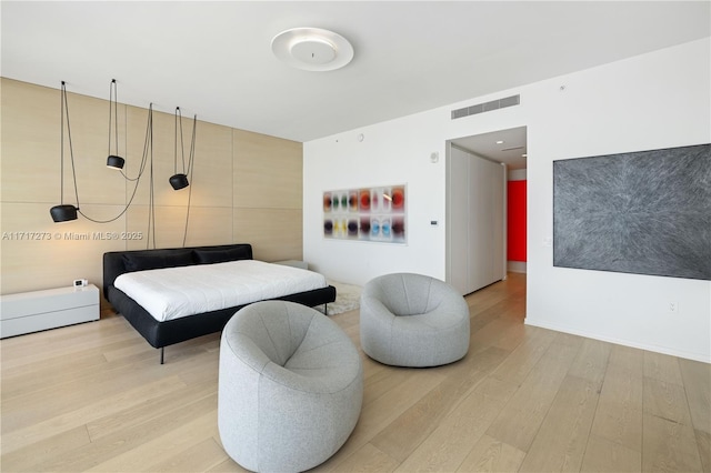 bedroom with wood-type flooring