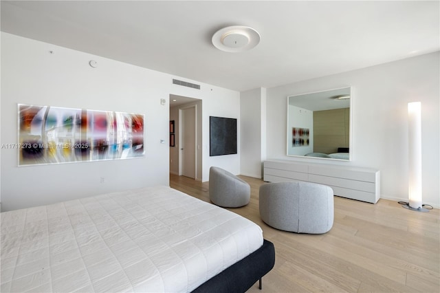 bedroom with light hardwood / wood-style floors