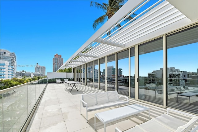 view of patio with a pergola and outdoor lounge area