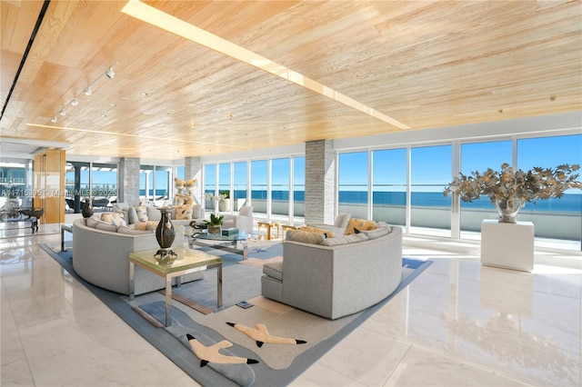 living room with a water view and wooden ceiling