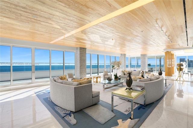 living room with light tile patterned floors, a water view, and wooden ceiling