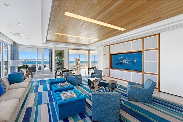 living room featuring a tray ceiling and wood ceiling