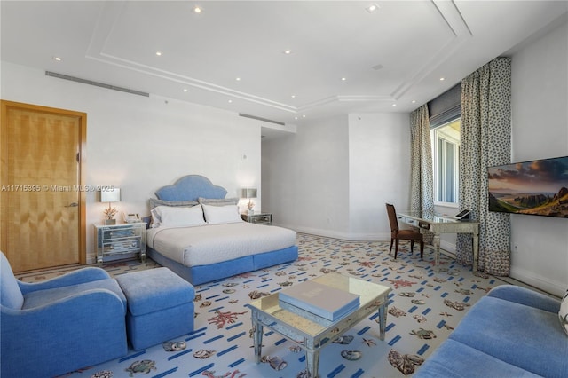 carpeted bedroom featuring a tray ceiling