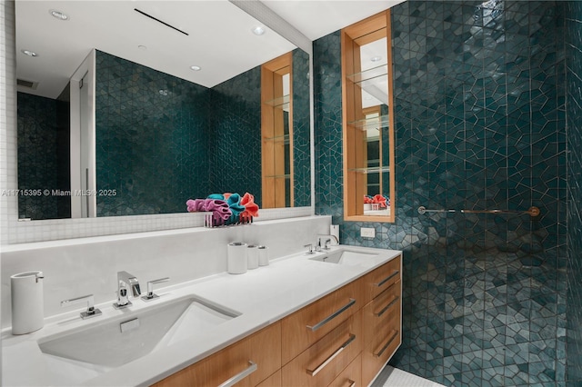 bathroom featuring beam ceiling, tile patterned flooring, vanity, and tile walls