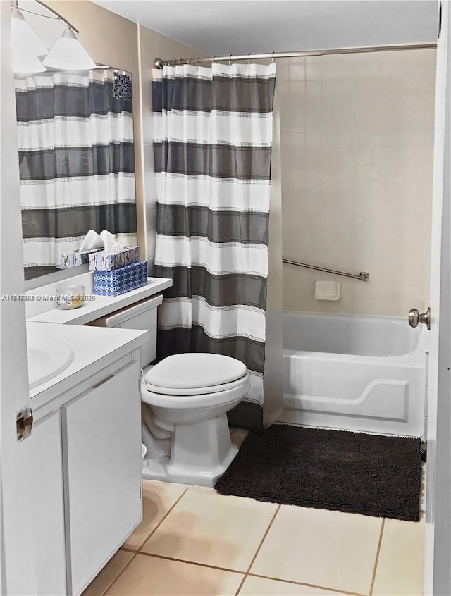 full bathroom with toilet, vanity, tile patterned floors, and shower / tub combo with curtain