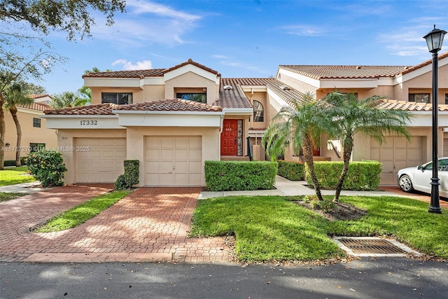 mediterranean / spanish-style home featuring a garage