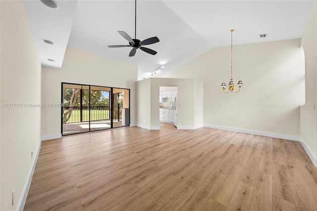 unfurnished living room featuring ceiling fan with notable chandelier, light hardwood / wood-style floors, and high vaulted ceiling