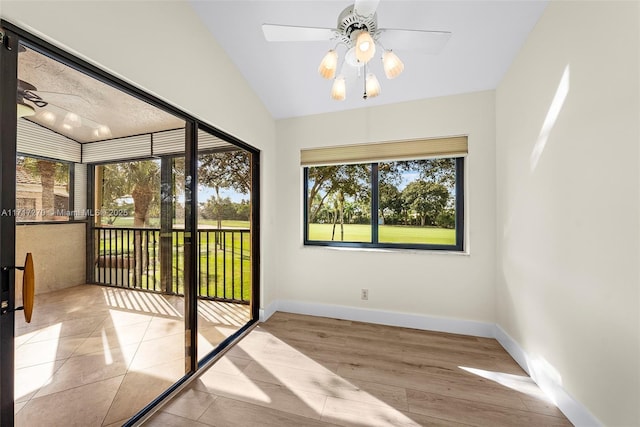 unfurnished sunroom with ceiling fan and lofted ceiling