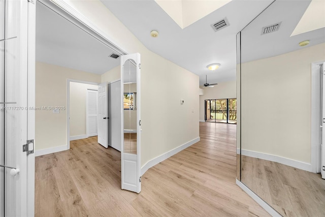 hall with light wood-type flooring