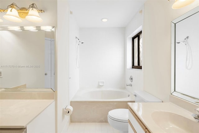 full bathroom with tile patterned flooring, vanity, tiled shower / bath combo, and toilet