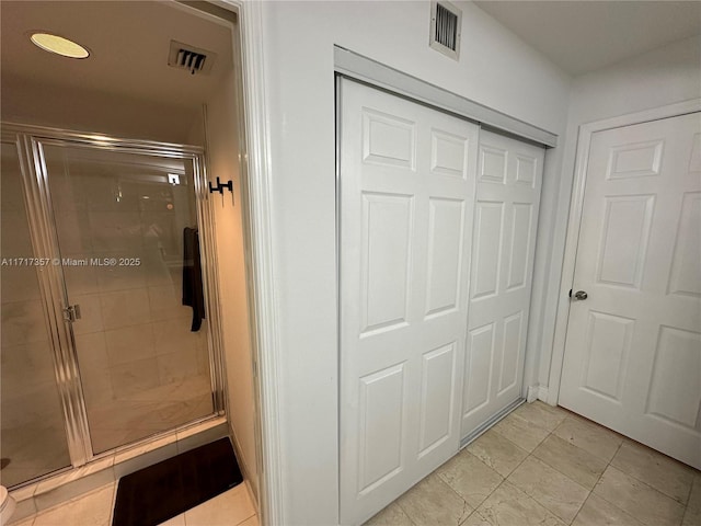 full bath featuring a stall shower and visible vents