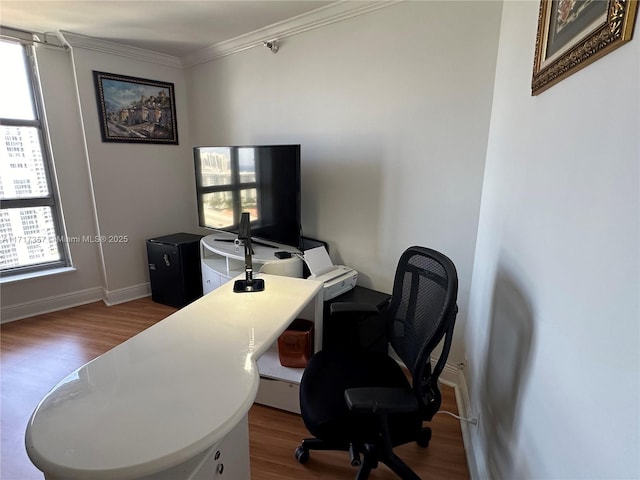 office area featuring ornamental molding, wood finished floors, and baseboards