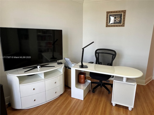 office space featuring light wood-type flooring and baseboards