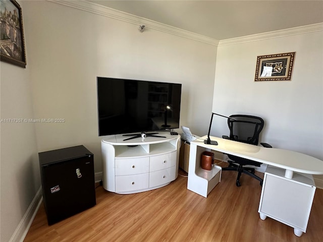 office featuring light wood-type flooring, baseboards, and ornamental molding