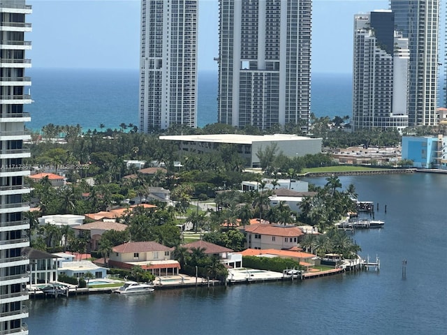 exterior space featuring a water view and a city view