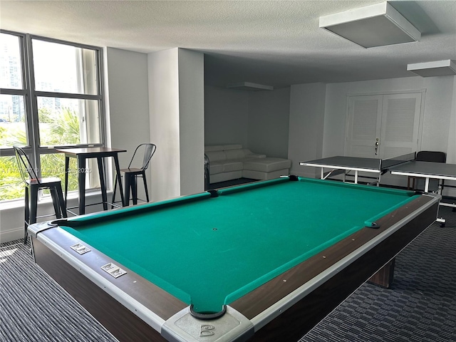 game room featuring carpet, a textured ceiling, and pool table