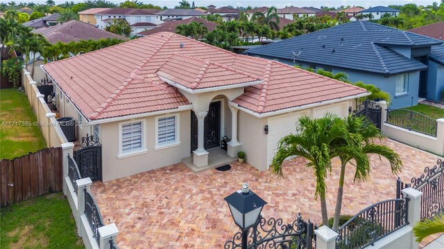 view of front of home featuring central AC unit and a garage