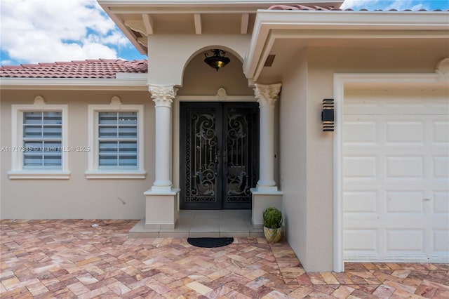 entrance to property featuring french doors