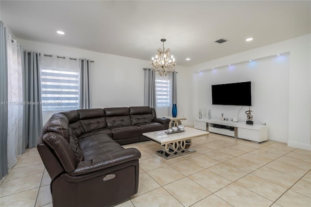 living room featuring light tile patterned floors and a notable chandelier