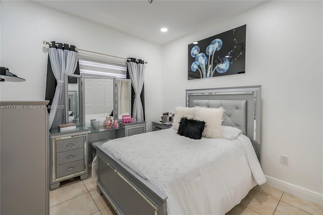 bedroom featuring light tile patterned floors