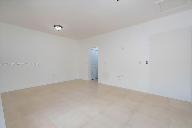 unfurnished room featuring light tile patterned floors