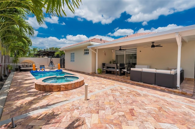 view of swimming pool with an in ground hot tub, an outdoor hangout area, ceiling fan, and a patio area