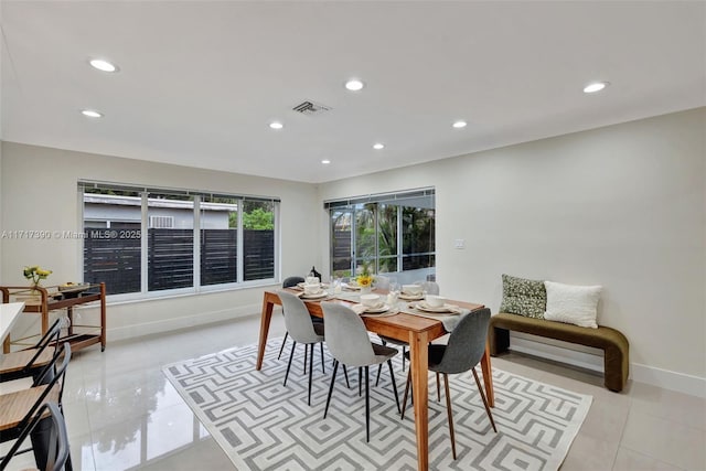 dining space with light tile patterned floors