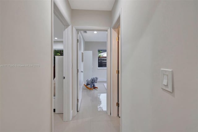 hallway with light tile patterned floors