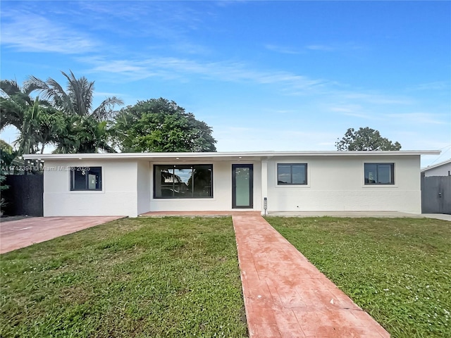 ranch-style house with a front lawn