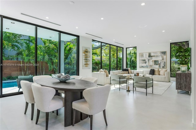 dining area featuring floor to ceiling windows