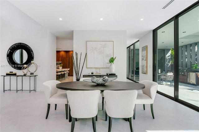 dining room with floor to ceiling windows