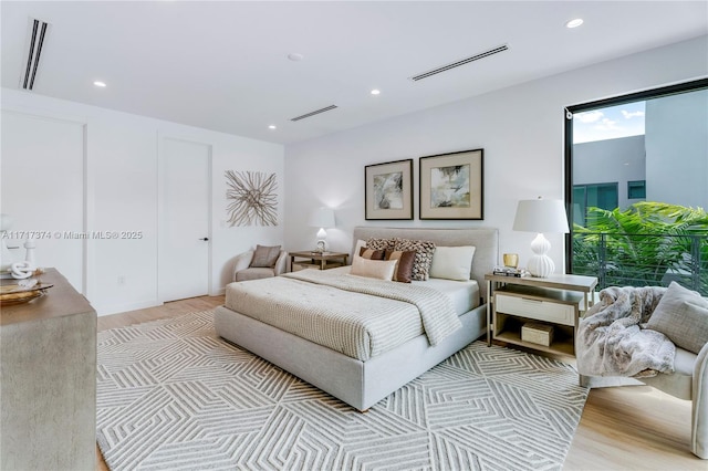 bedroom with light wood-type flooring