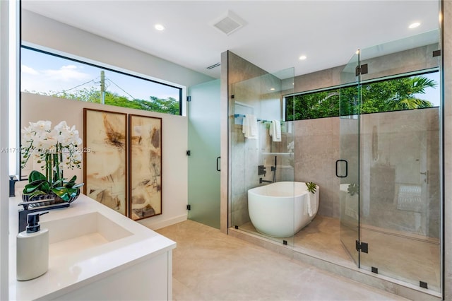 bathroom with sink and plus walk in shower