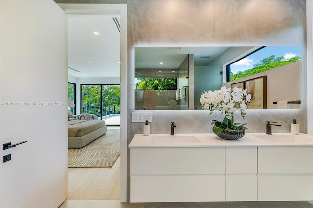 bathroom featuring vanity and decorative backsplash