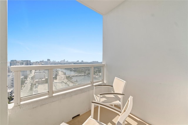 balcony featuring a water view