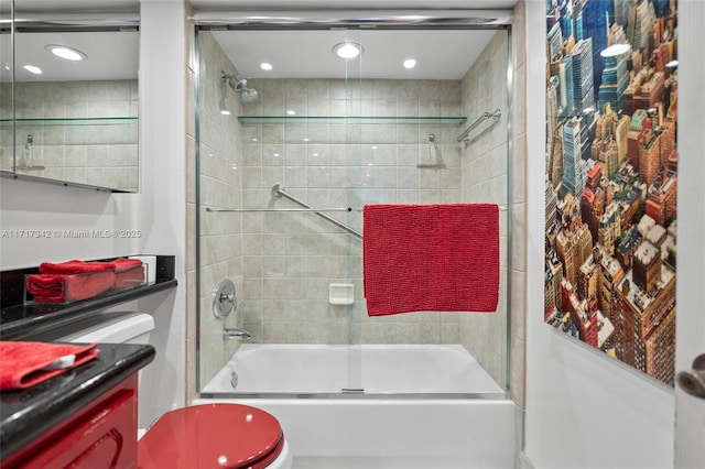 full bathroom with shower / bath combination with glass door, vanity, and toilet