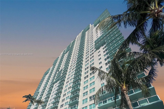 view of outdoor building at dusk