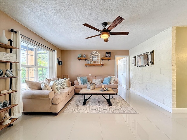 tiled living room with ceiling fan and a textured ceiling