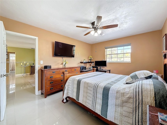 bedroom featuring ceiling fan and light tile patterned flooring