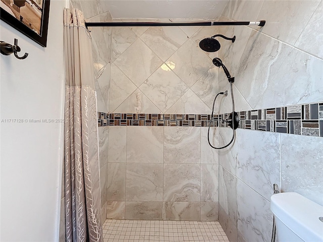 bathroom with a shower with curtain and toilet