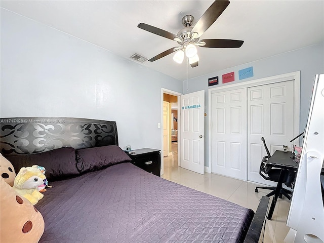 tiled bedroom featuring a closet and ceiling fan