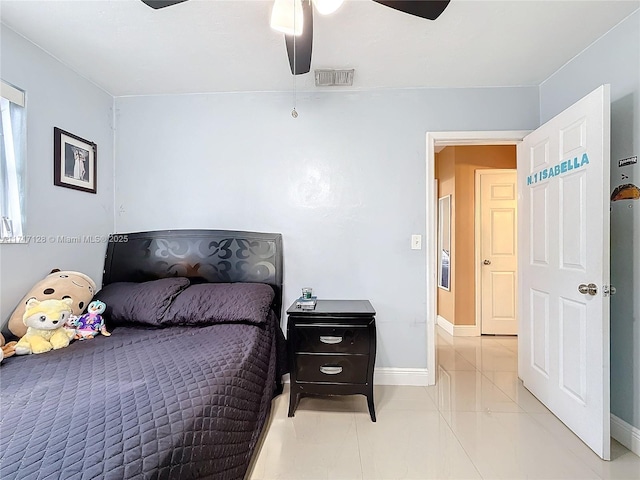 bedroom featuring light tile patterned floors and ceiling fan