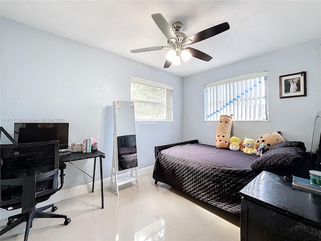 tiled bedroom with ceiling fan