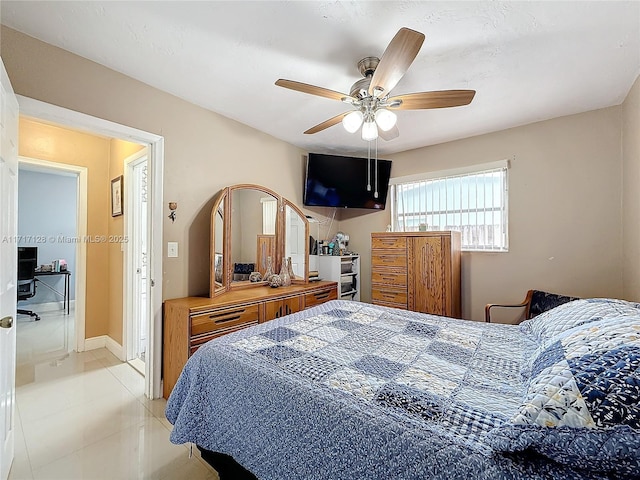 bedroom with light tile patterned floors and ceiling fan