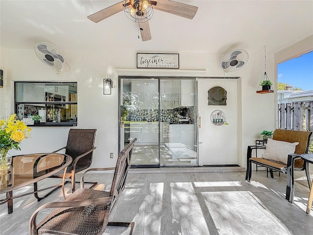 interior space featuring ceiling fan