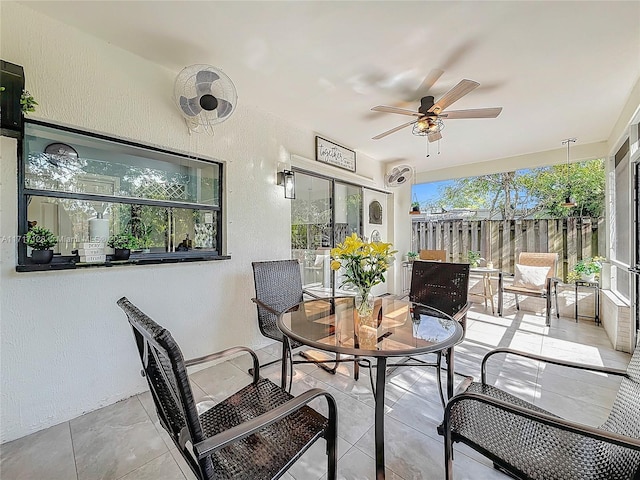 exterior space featuring ceiling fan