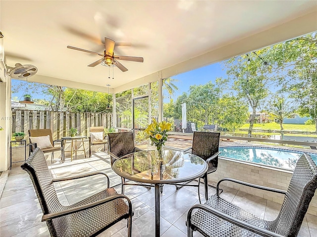 sunroom / solarium with ceiling fan