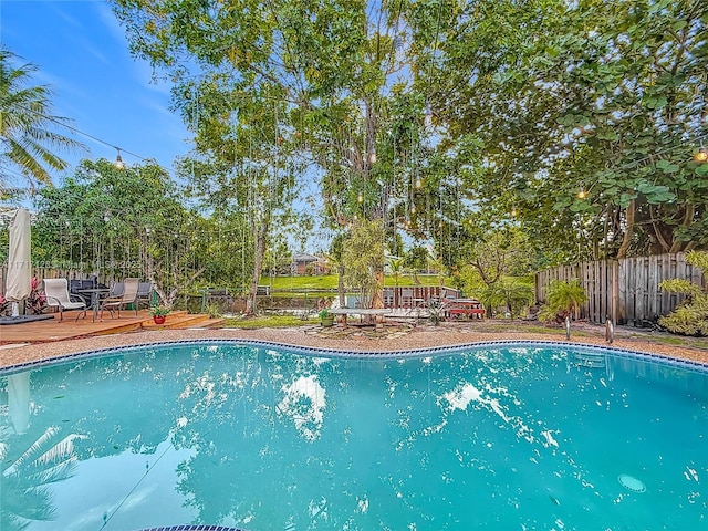 view of pool featuring a wooden deck